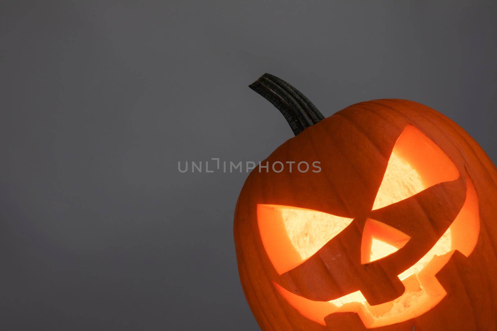 Halloween pumpkin on gray background with copy space for text content, banner design template