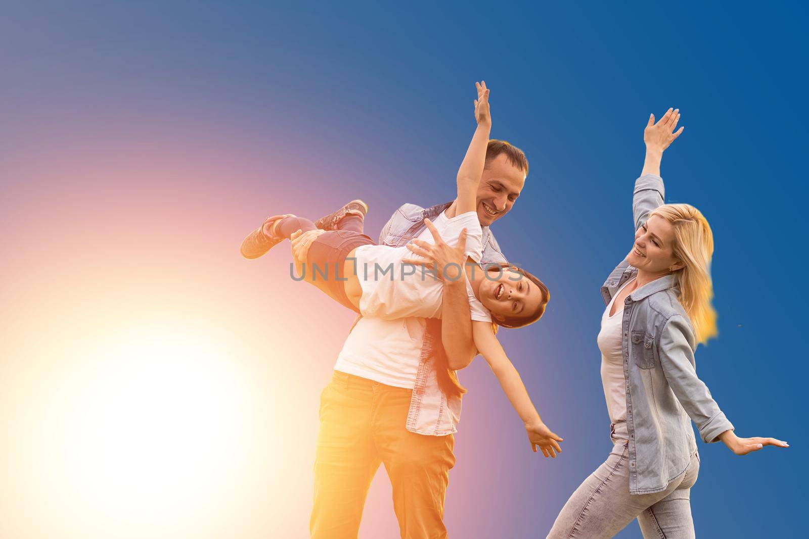 funny young parents mom dad with child kid daughter teen girl isolated on blue background. Family day parenthood concept.
