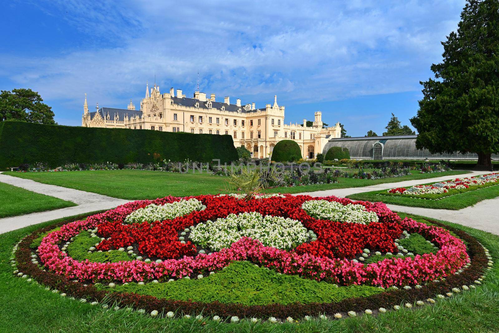 A beautiful castle with a garden and a park. Lednice - Czech Republic - South Moravia. A popular tourist spot for travel and excursions. Landscape with nature in summer time.