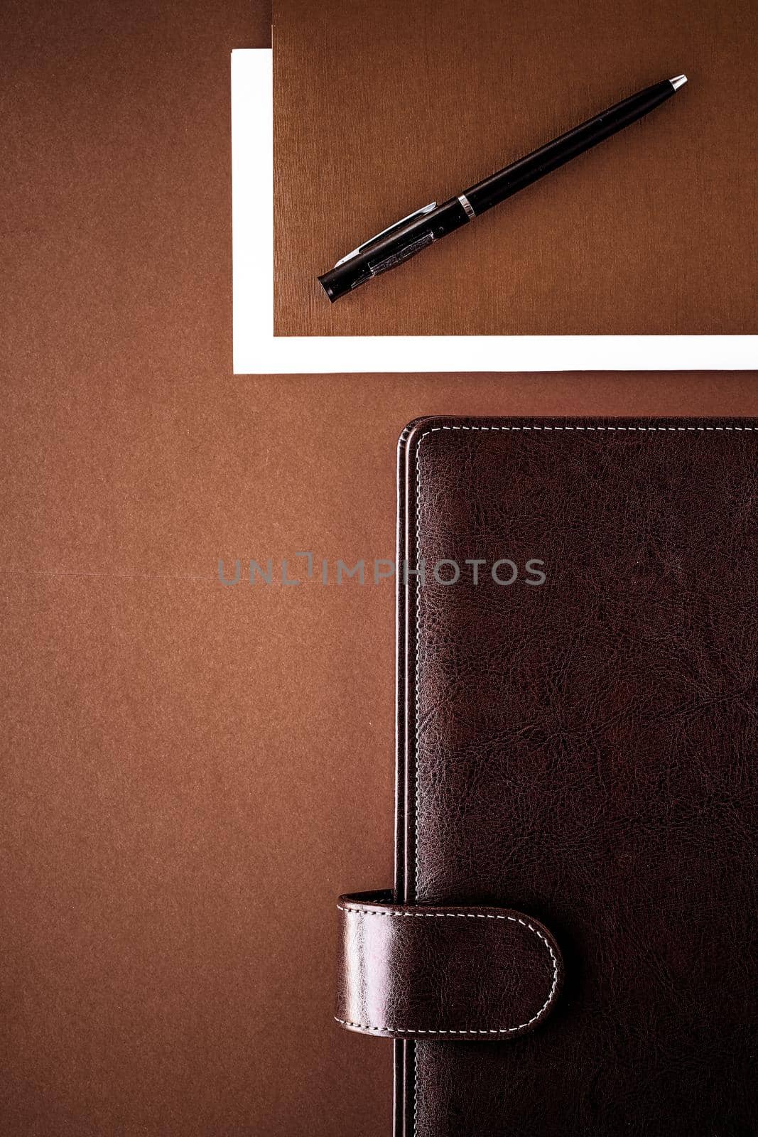 Vintage business briefcase on the office table desk, flatlay background by Anneleven