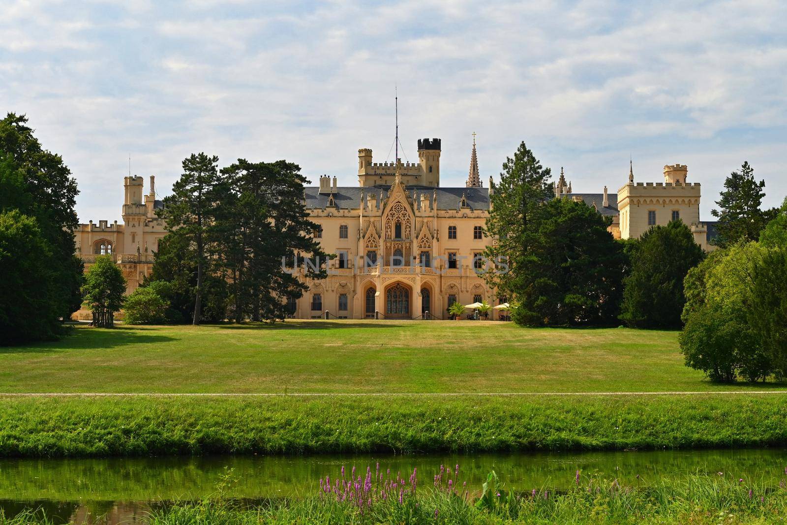 A beautiful castle with a garden and a park. Lednice - Czech Republic - South Moravia. A popular tourist spot for travel and excursions. Landscape with nature in summer time.