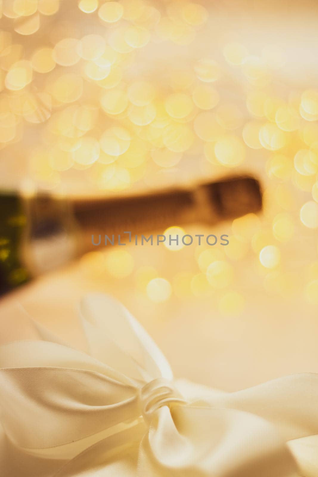 Romantic celebration, lifestyle and luxury present concept - The bottle of champagne and holiday gift box