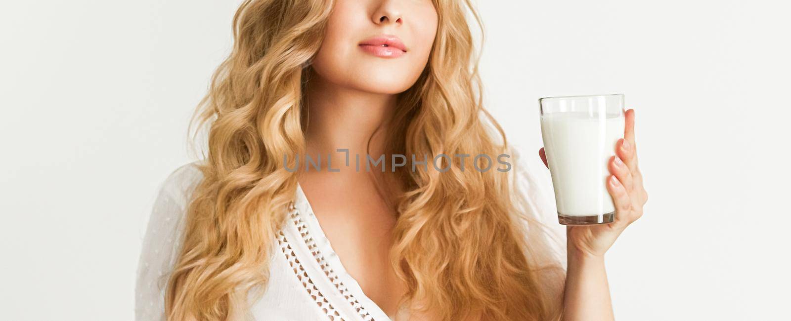 Diet, health and wellness, woman holding glass of milk or protein shake cocktail by Anneleven