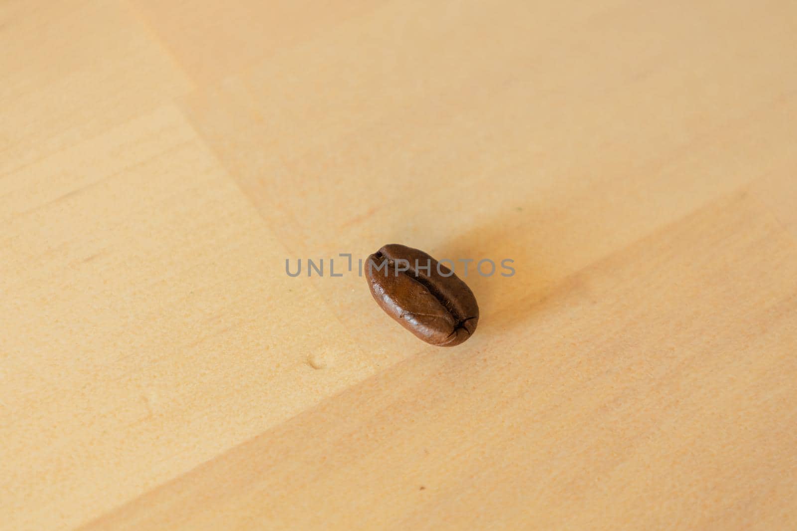 Close-up of Roasted coffee bean on wooden background. High-quality photo