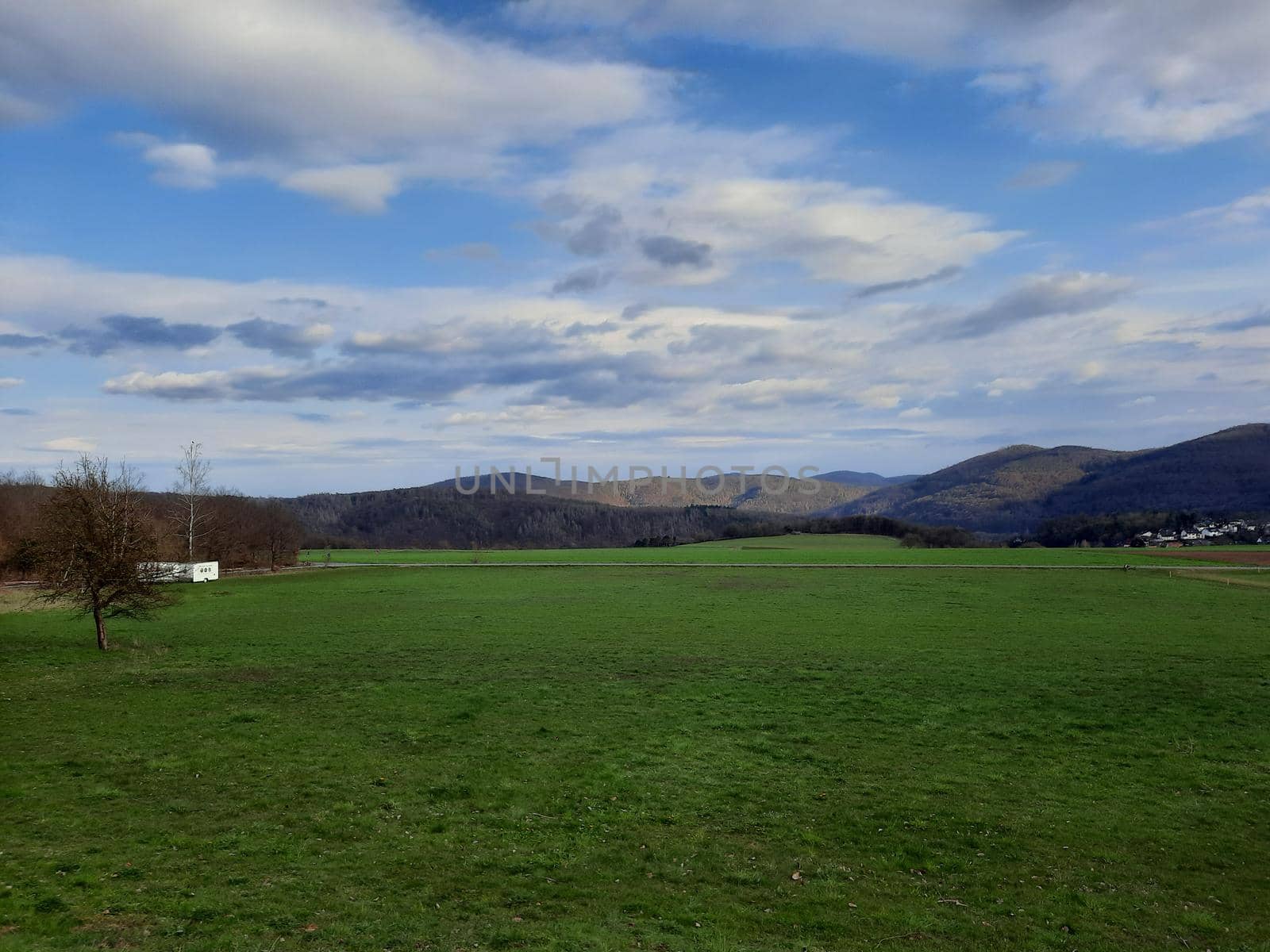 Blue sky with cloudy weather, nature cloud over the landskape. Beauty cloud against a blue sky background. Sky slouds. Over the land white clouds, blue sky by Costin