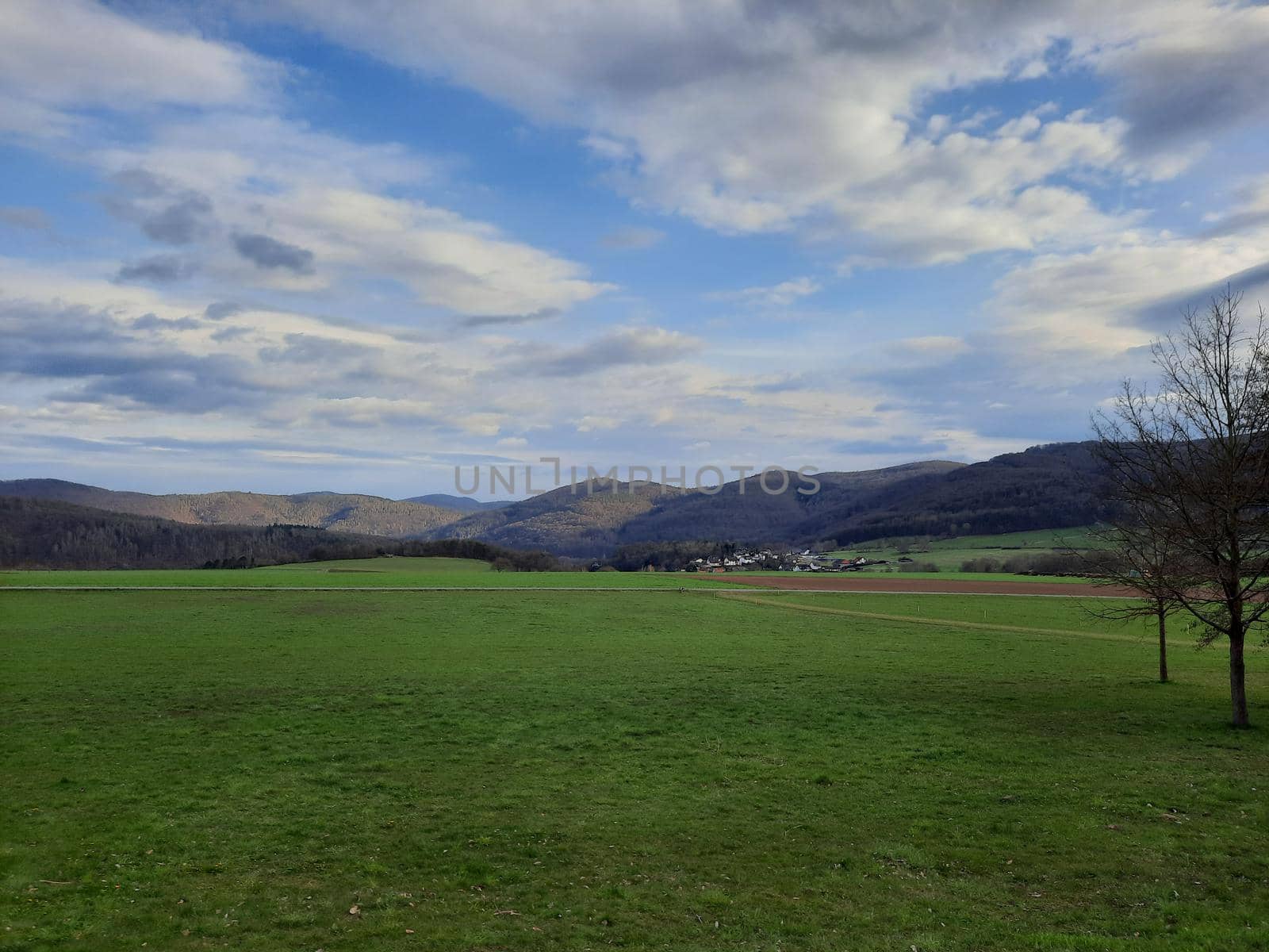 Blue sky with cloudy weather, nature cloud over the landskape. Beauty cloud against a blue sky background. Sky slouds. Over the land white clouds, blue sky by Costin