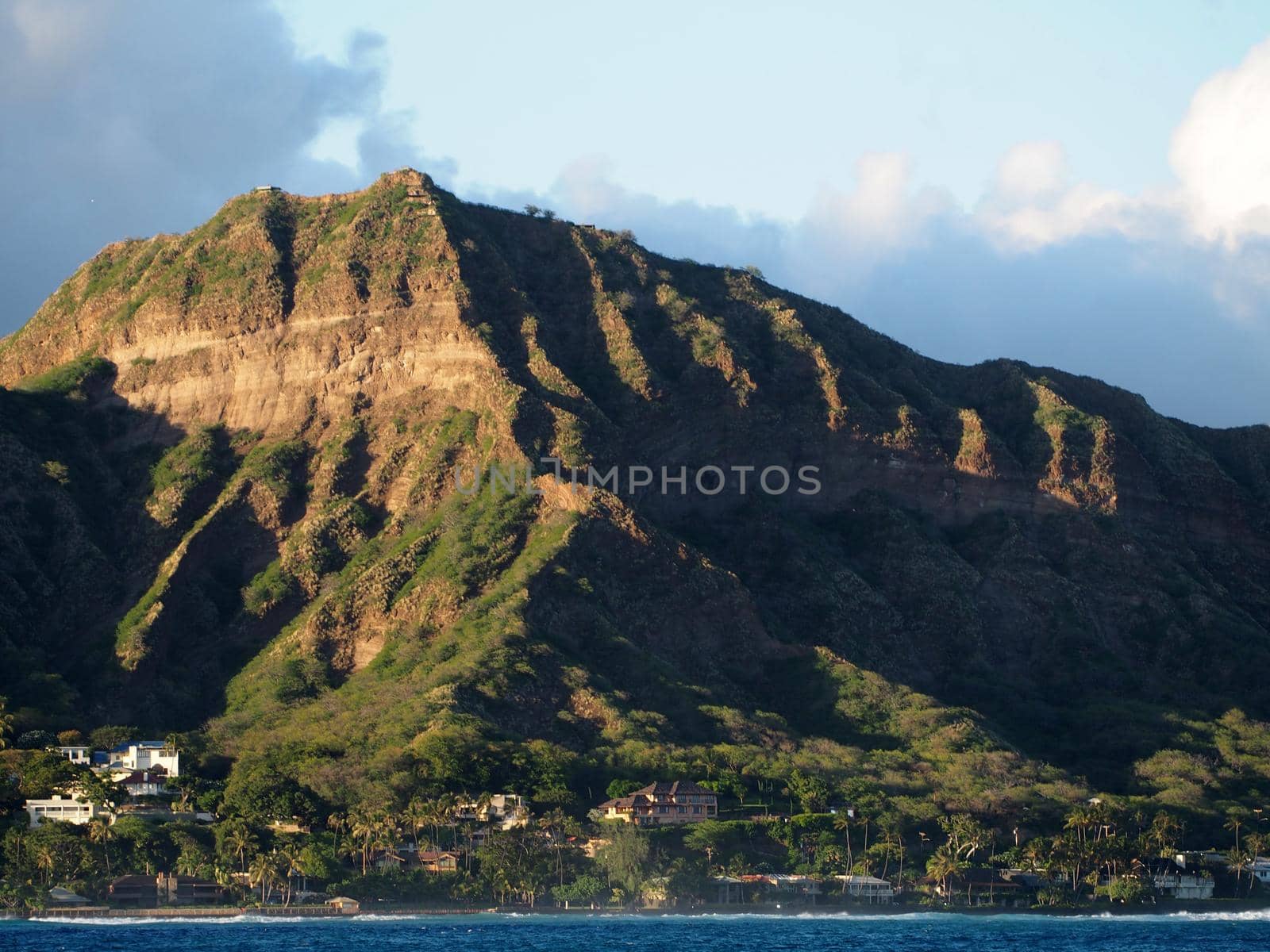 Leahi Beach Park, Diamond Head Crater, and coastline seen from the ocean on Oahu, Hawaii.