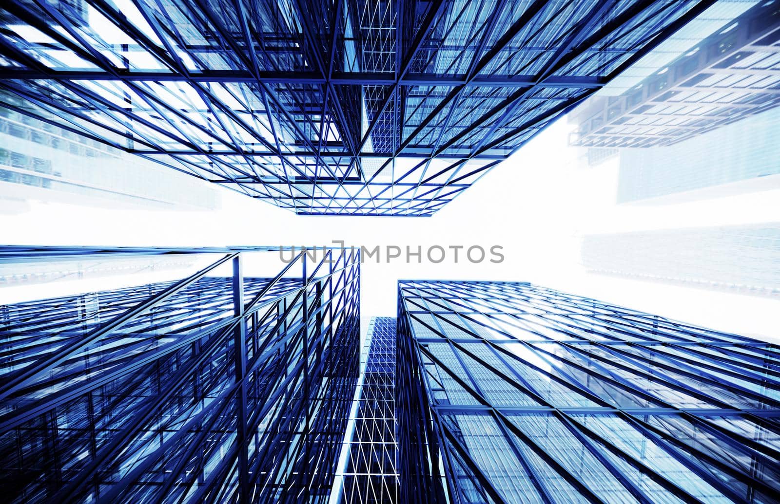 Glass buildings business concept. The glass facade of a skyscraper with a mirror reflection of sky windows. Modern office building with glass facade on a clear sky background. 3D Illustration.