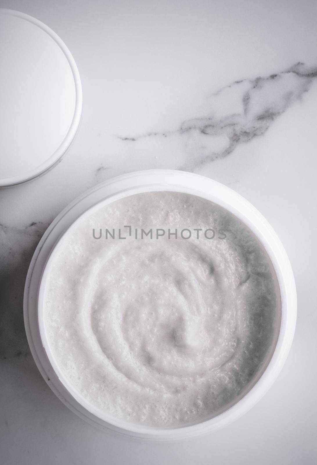 Skincare and body care, luxury spa and clean cosmetic concept. Health and beauty of your skin - Scrub and exfoliating cream products on a marble, flatlay