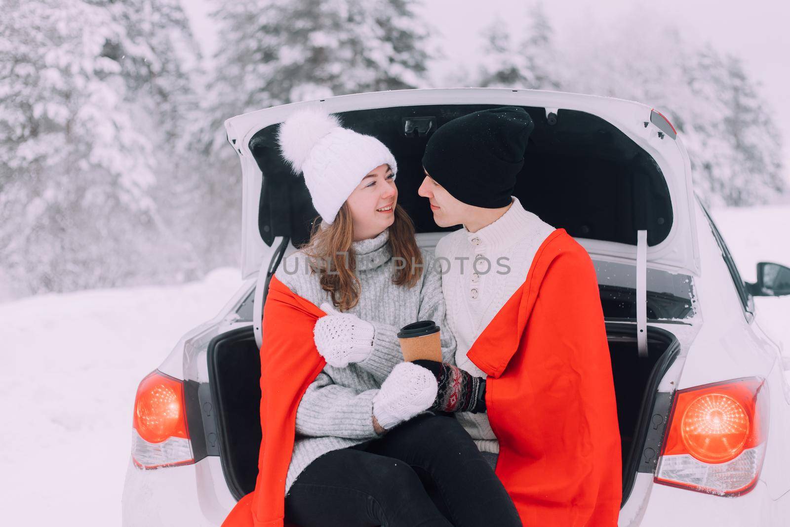 A couple in love in the trunk of a car lifestyle , An article about couples in love. An article about winter . Valentine's day. Love