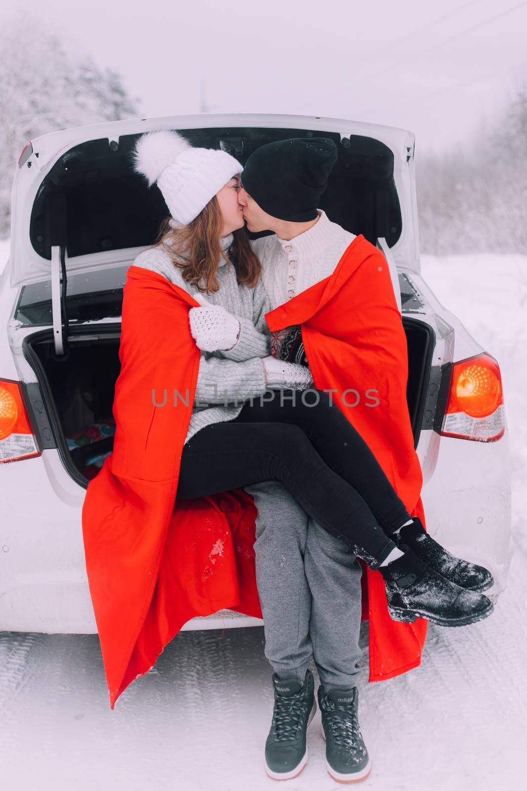 A couple in love in the trunk of a car lifestyle , An article about couples in love. An article about winter . Valentine's day. by alenka2194