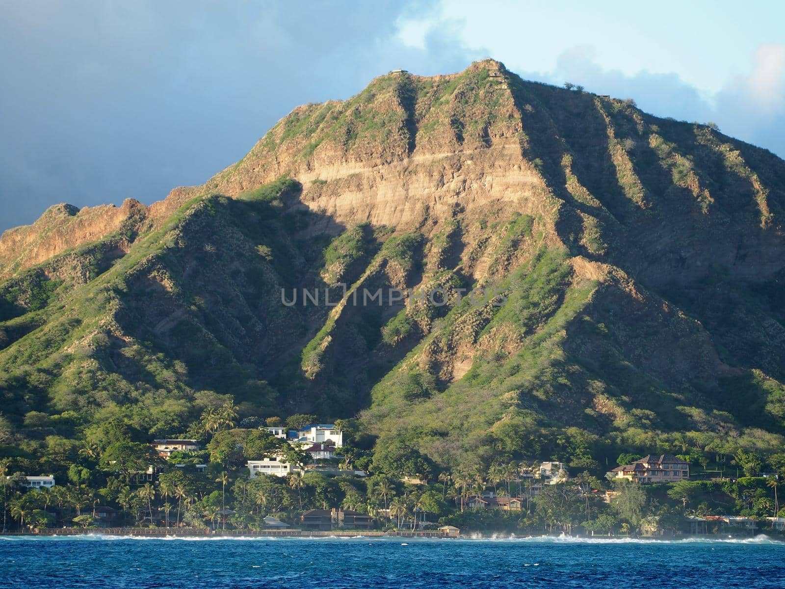 Leahi Beach Park, Diamond Head Crater, and coastline seen from the ocean on Oahu, Hawaii.