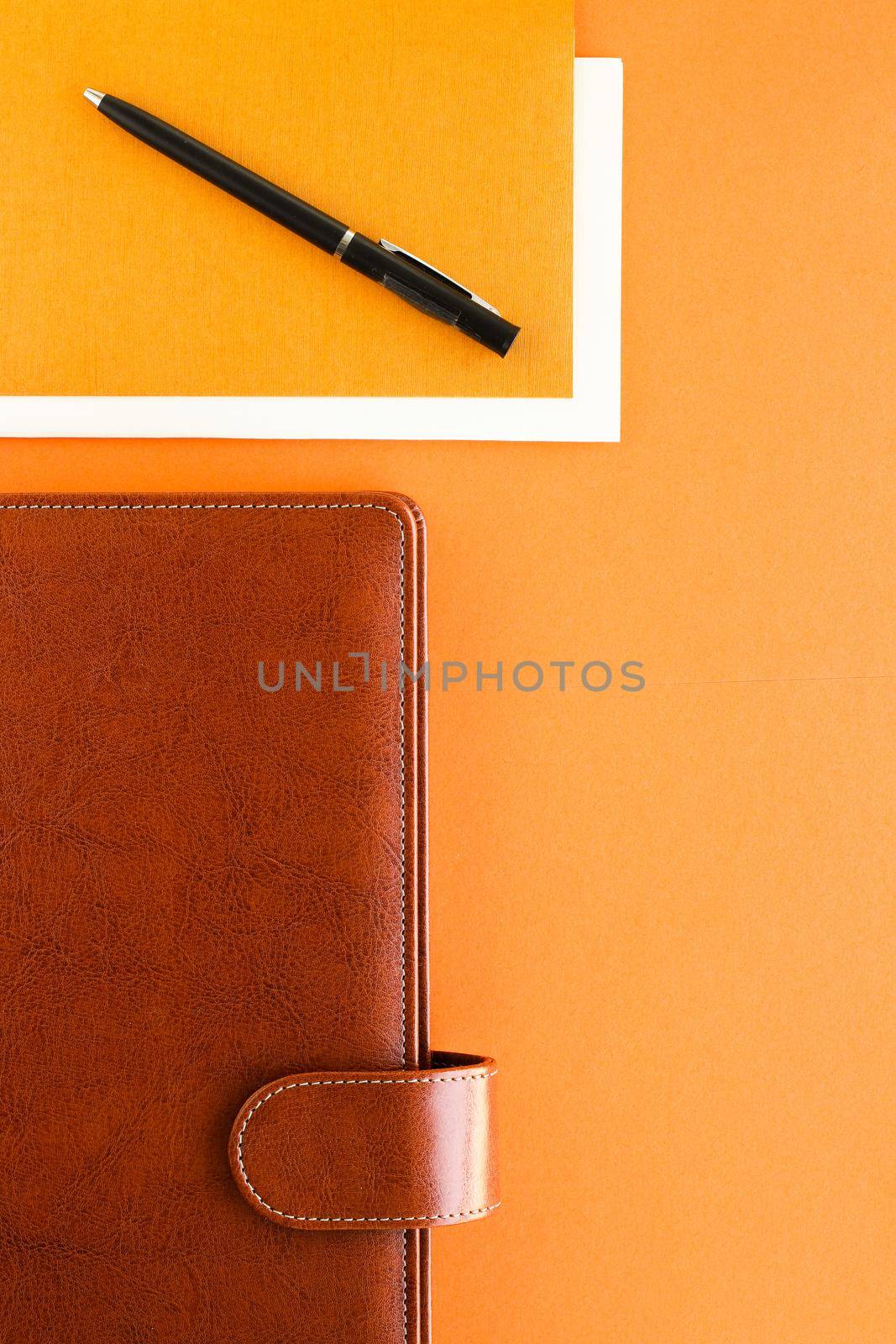 Modern workspace, productivity and corporate lifestyle concept - Luxury business brown brief-case on the office table desk, flatlay