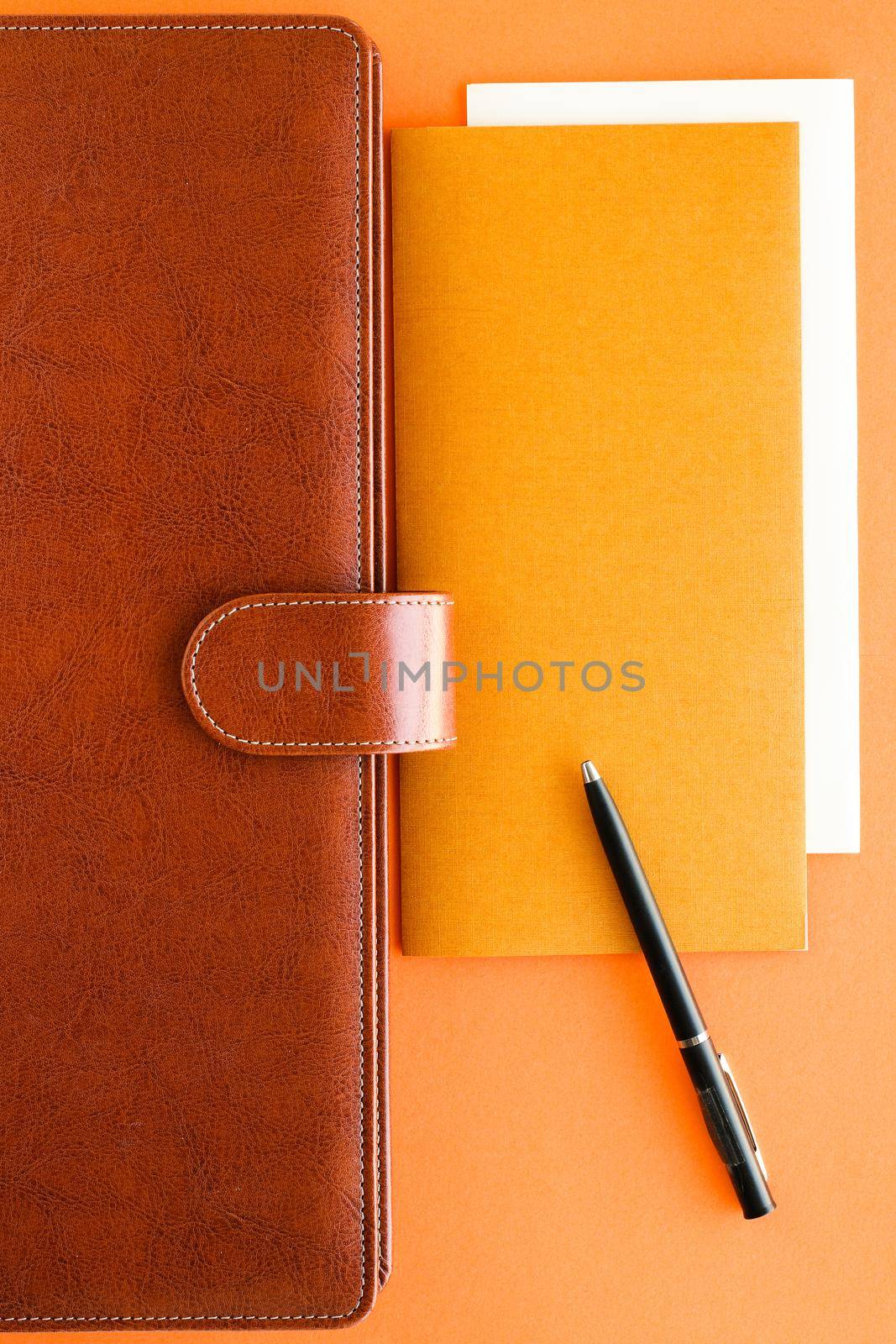 Modern workspace, productivity and corporate lifestyle concept - Luxury business brown brief-case on the office table desk, flatlay