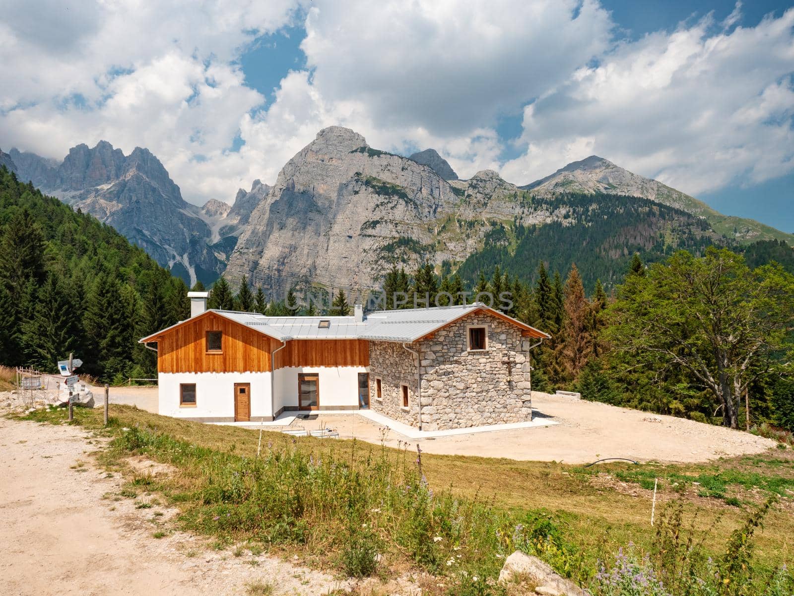 Mountain cottage panorama and Croz of the Altissimo mountain, Croz dell'Altissimo. Molveno, region Trentino, Italy . 