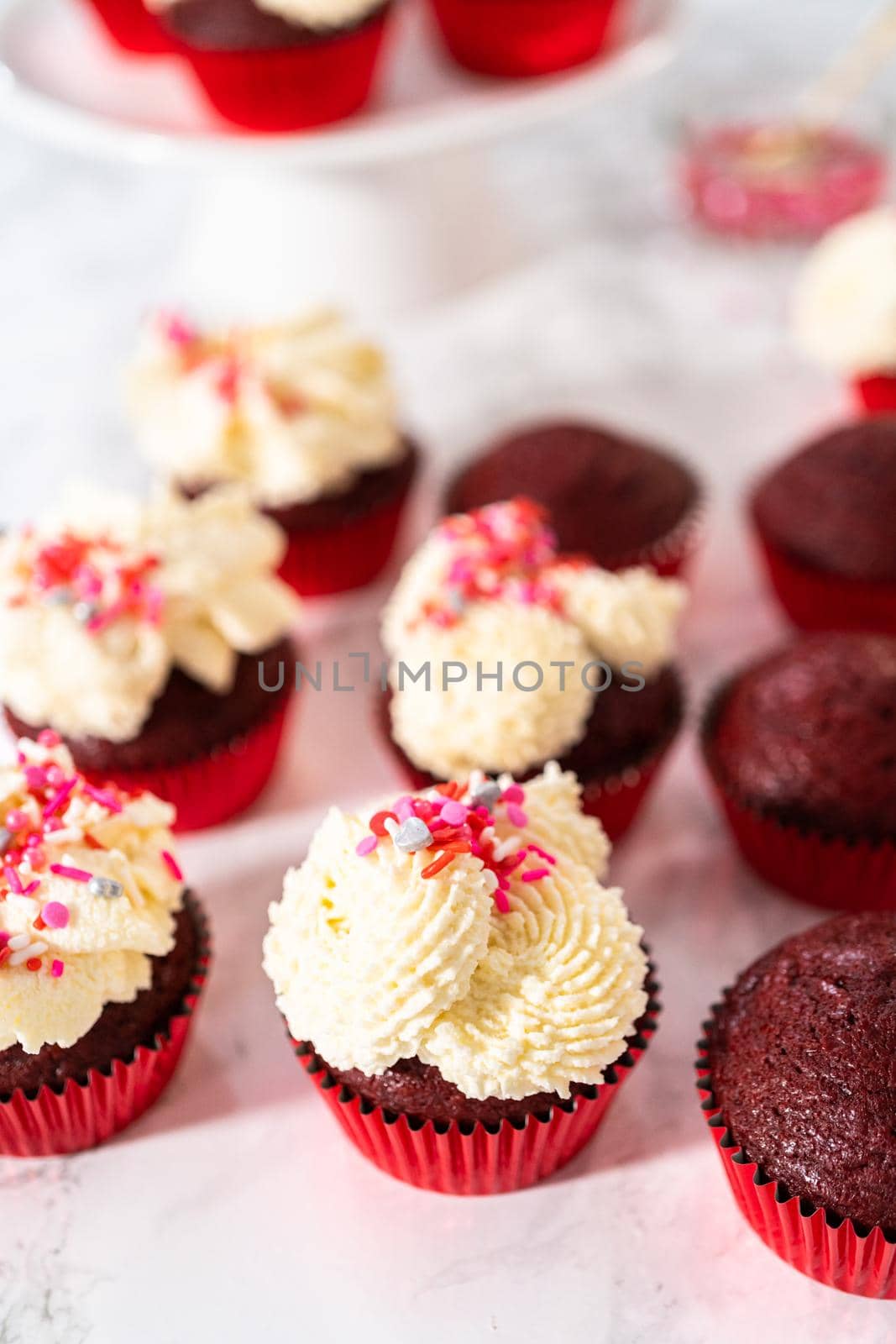 Red Velvet Cupcakes with White Chocolate Ganache Frosting by arinahabich