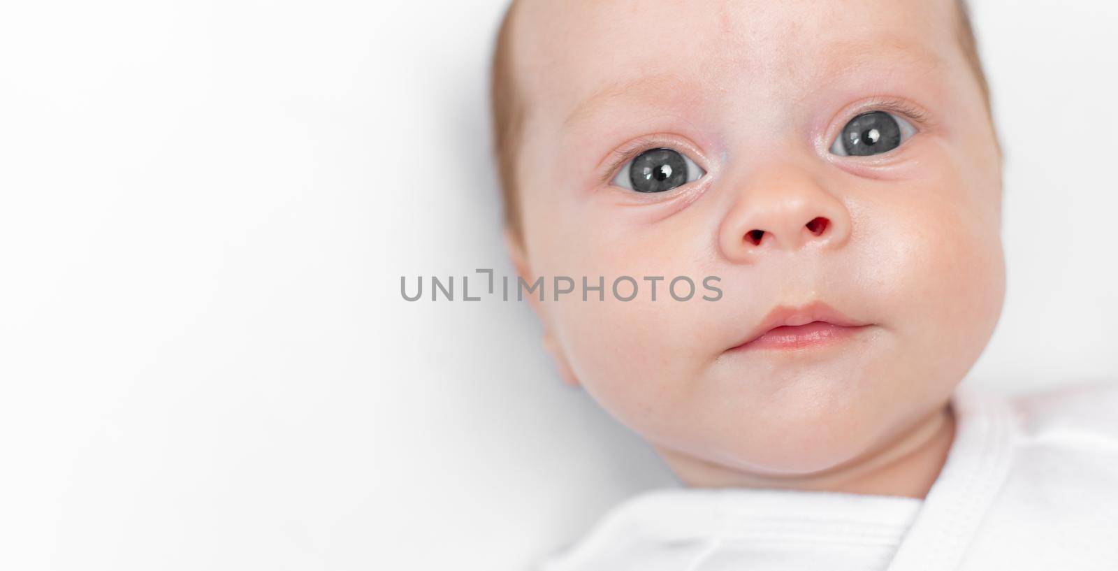Portrait of a baby on a white background . Children of copyspace . An article about children . Advertising of children 's products . Child 0-3 months old
