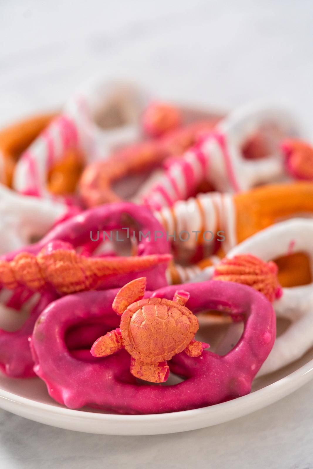 Gourmet chocolate-covered pretzel twists with seashell-shaped chocolates.