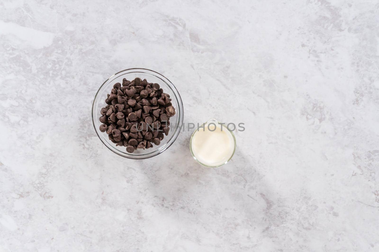 Flat lay. Preparing chocolate ganache to bake s'mores cupcakes.