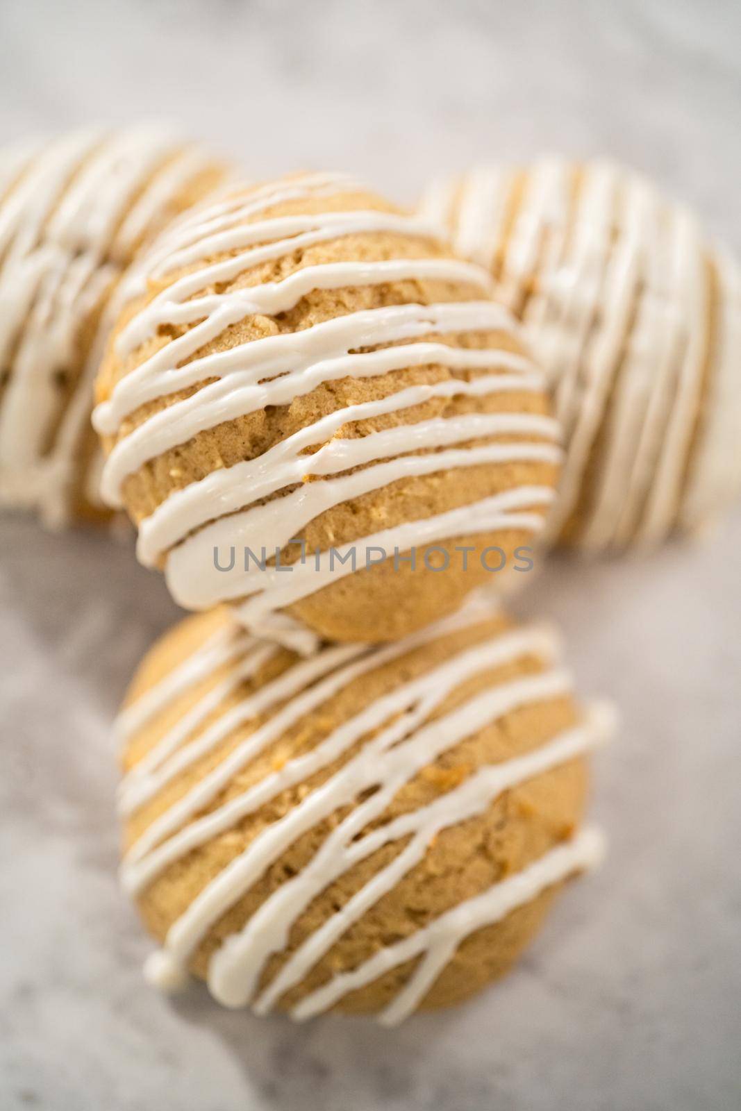 Freshly baked chocolate cookies with eggnog scones with a white chocolate drizzle on top.