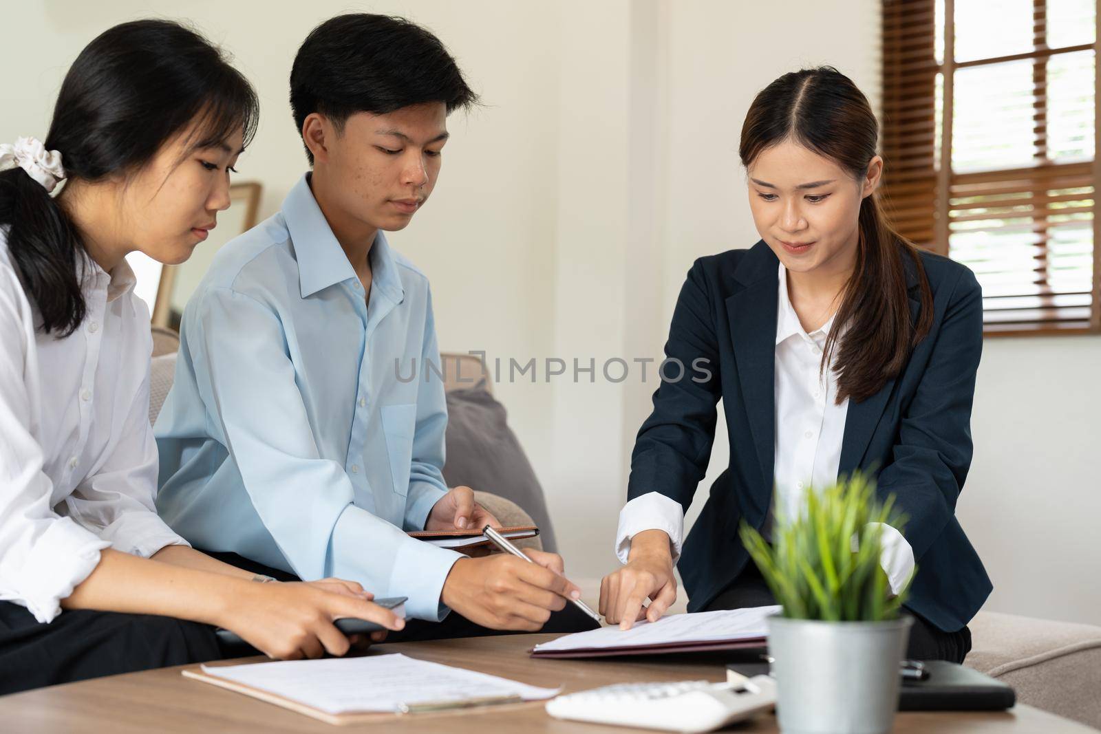 Businessman and partner signing contract on the meeting room
