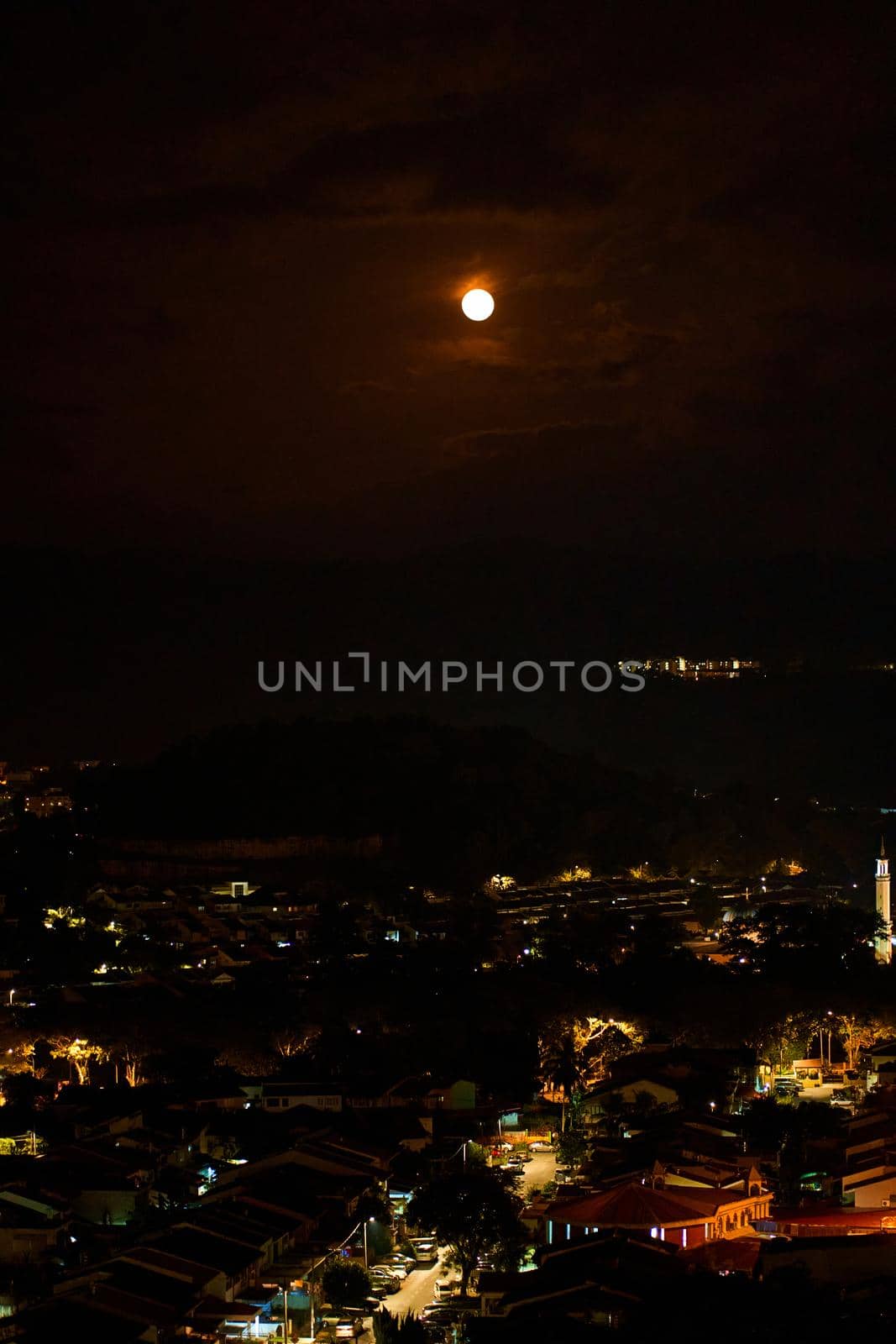 bright full moon in the night sky over the city by Try_my_best