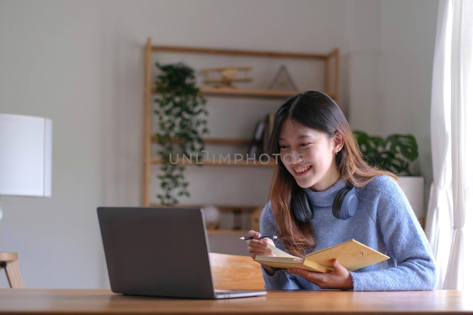 Asian girl student online learning class study online video call zoom teacher, Happy asian girl learn english language online with computer laptop. by wichayada