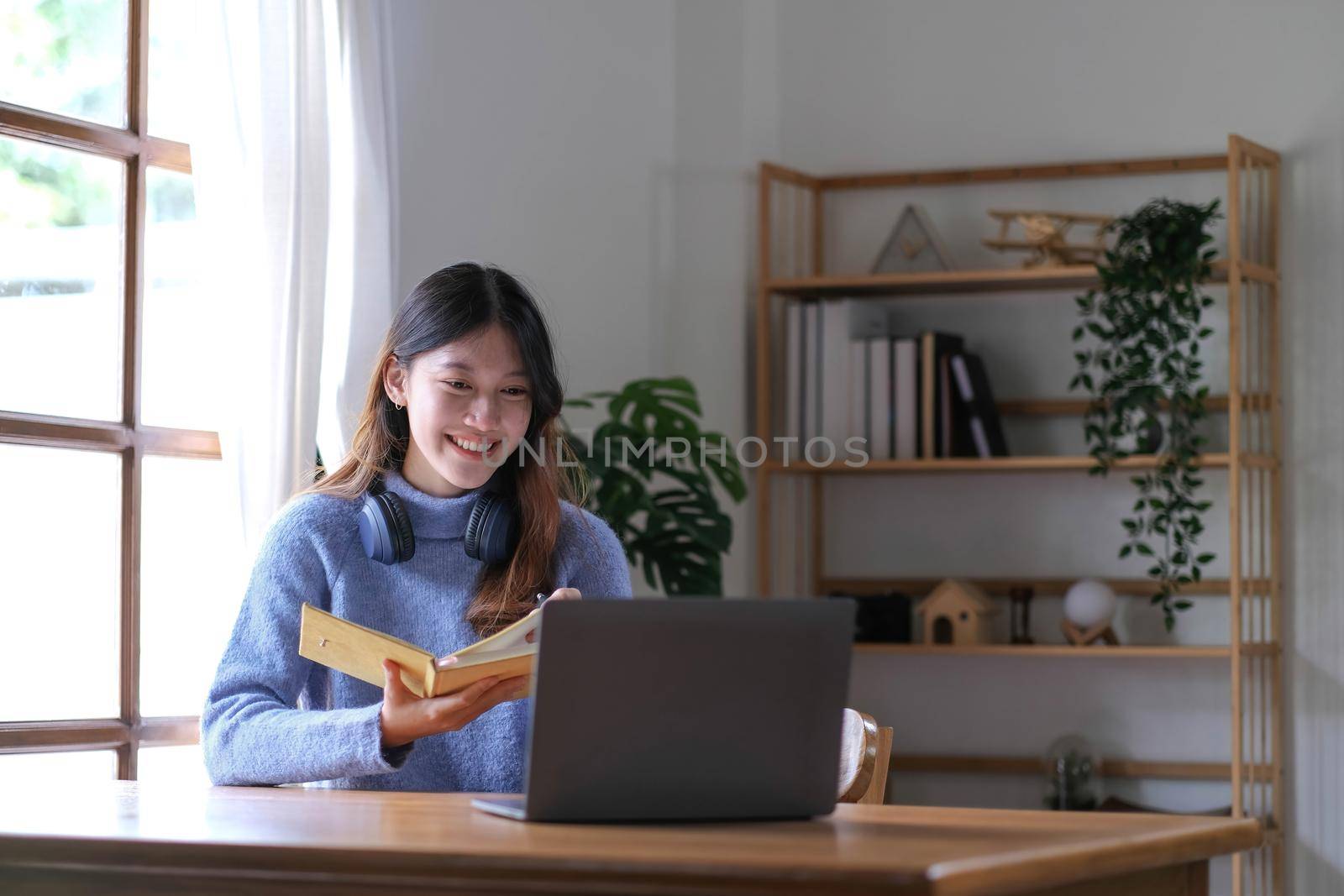 Asian girl student online learning class study online video call zoom teacher, Happy asian girl learn english language online with computer laptop. by wichayada
