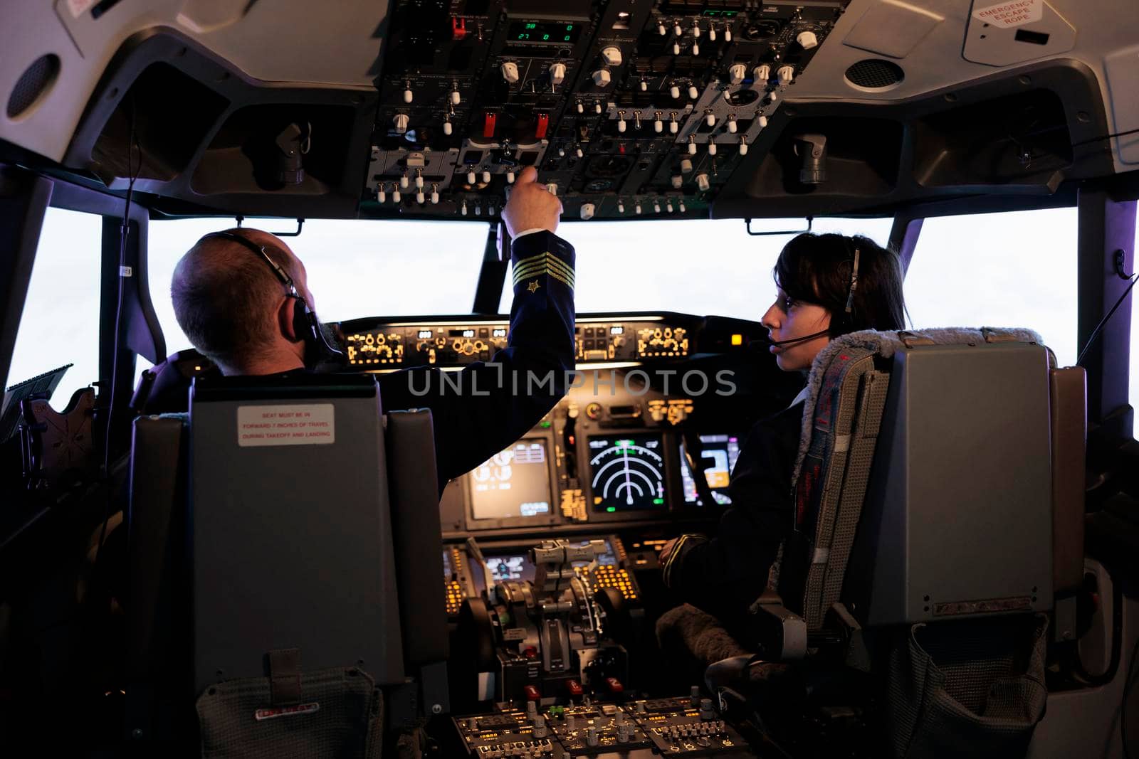 Captain and copilot using dashboard command to takeoff with plane by DCStudio