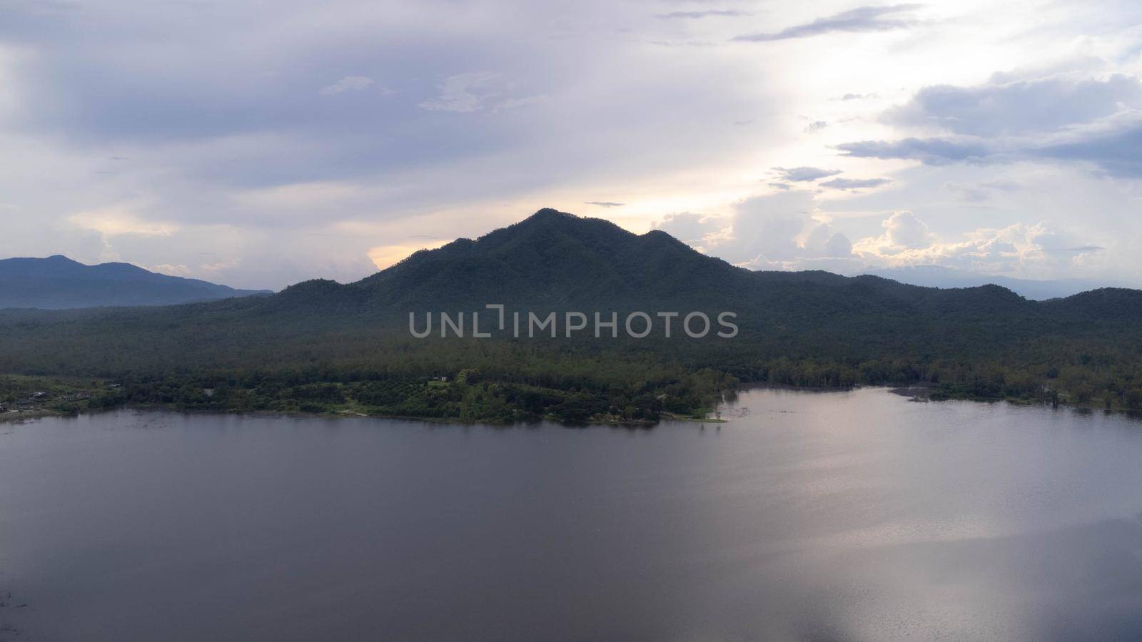 Aerial view of reservoir on tropical mountain background at sunset in northern Thailand. Beautiful landscape nature background.
