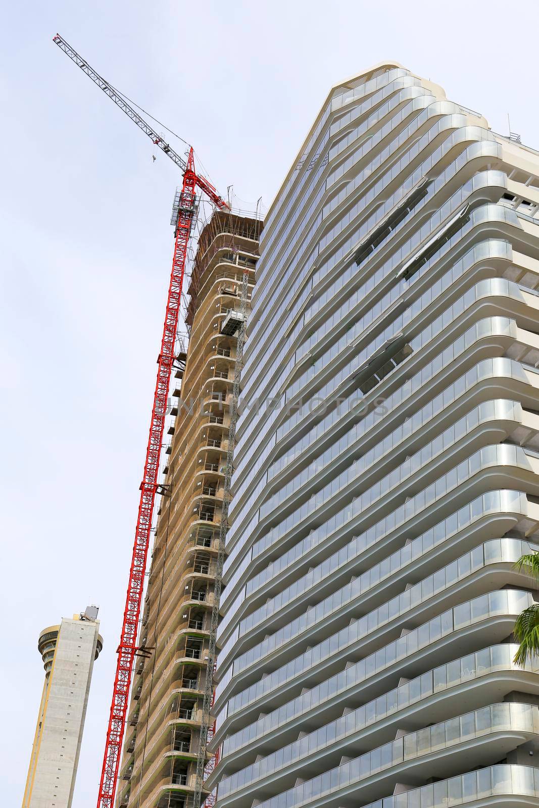 Benidorm, Alicante, Spain- September 11, 2022: Modern architecture building called Sunset Cliffs under construction in the Poniente Beach Area in Benidorm