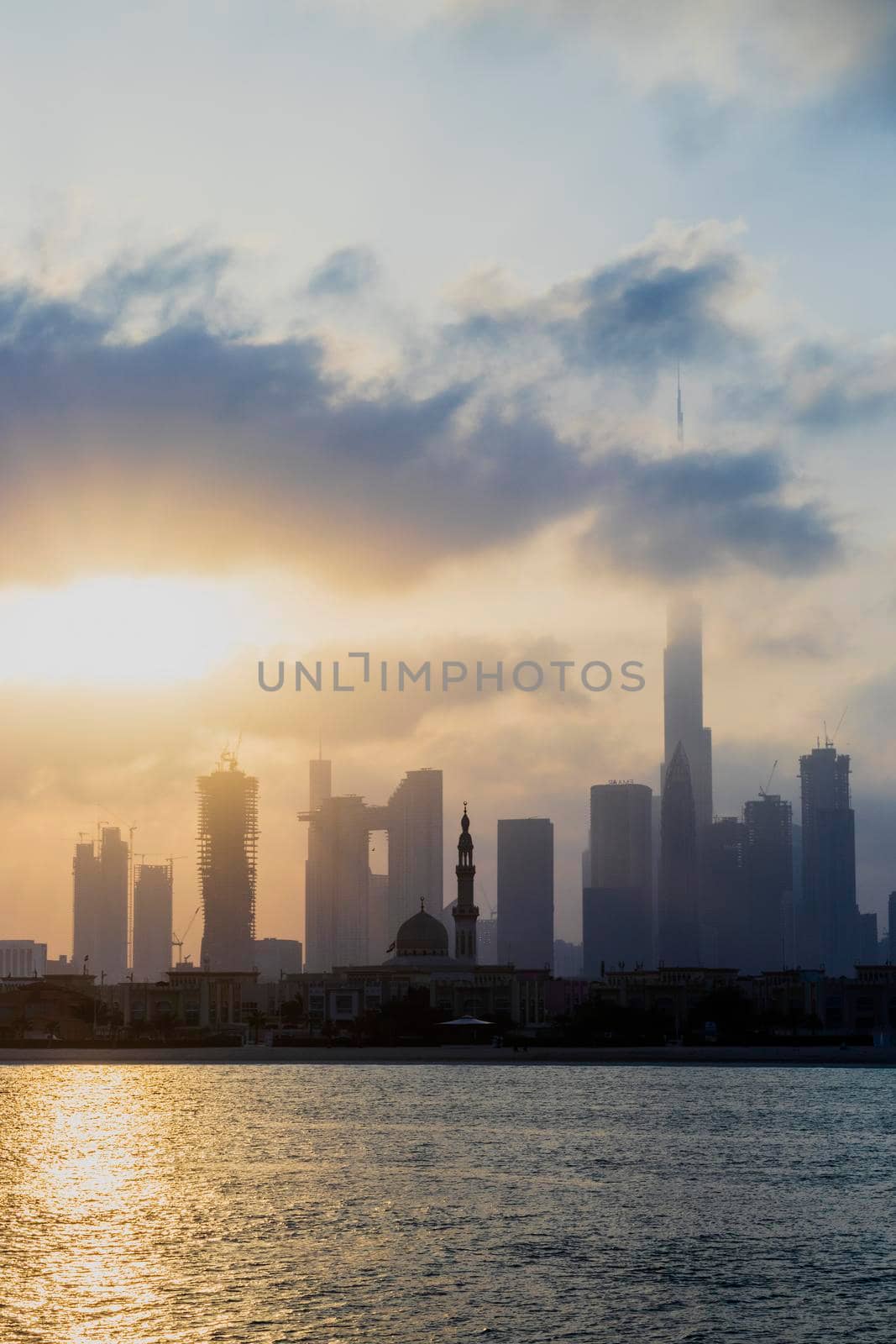 Dubai, UAE - 03.06.2021 Dubai public beach with city skyline on background.Sunrise hour