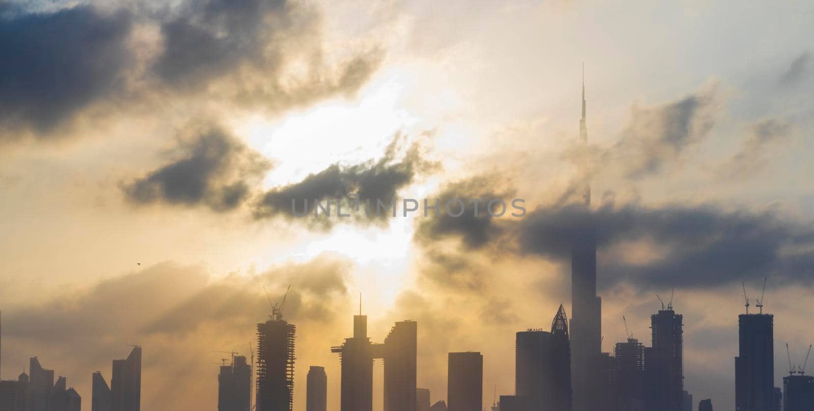 Dubai, UAE - 03.06.2021 Dubai public beach with city skyline on background.Sunrise hour. Outdoor by pazemin