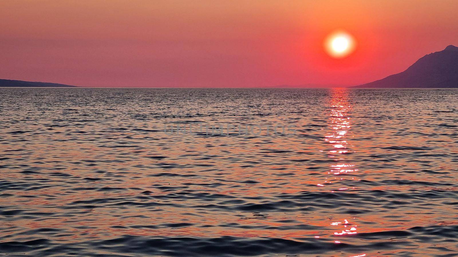 Beautiful red sunset over the Adriatic sea. Makarska Riviera-Biokovo, Dalmatia, Croatia, Europe by anytka