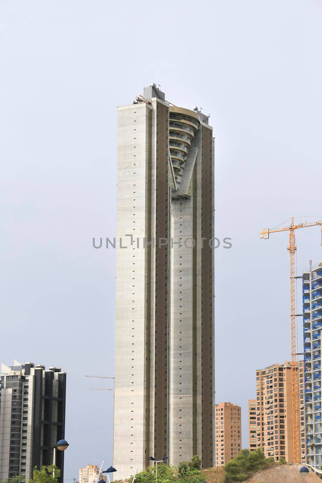 Benidorm, Alicante, Spain- September 11, 2022: Modern architecture building called Intempo next to building under construction in the Poniente Beach Area in Benidorm