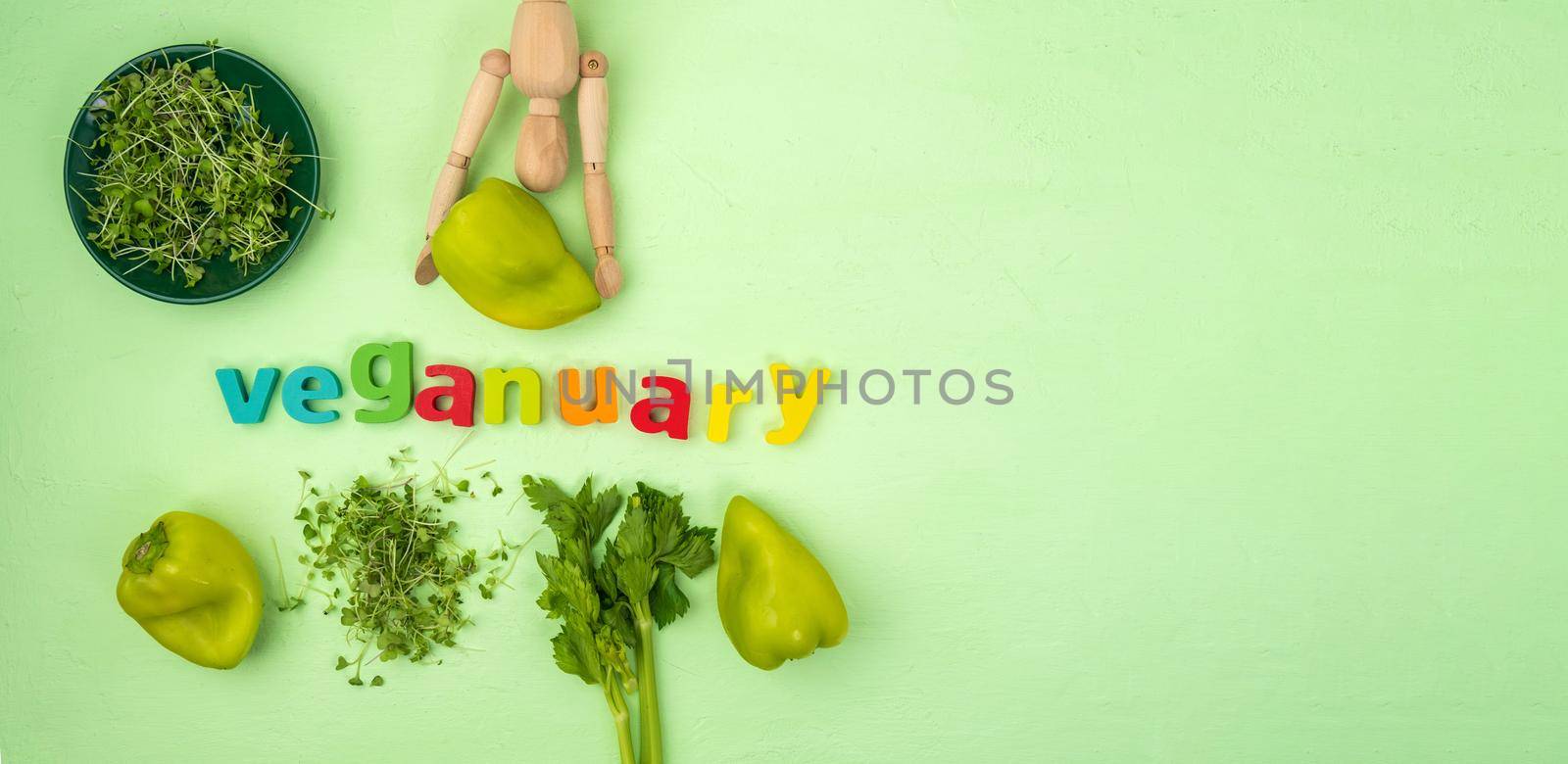 Veganuary written, vegan diet month in january called Veganuary. Flat lay. Copy space by darksoul72