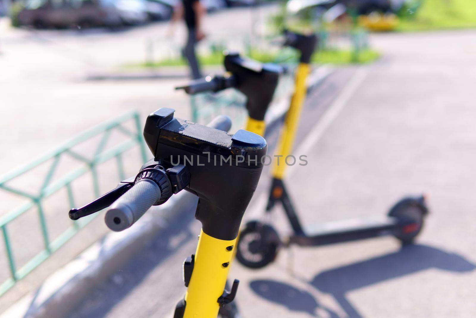 Electric scooter rental, City bike rental system, public kick scooter on the street. Selective focus