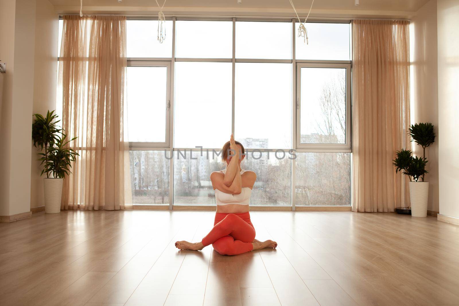 Mature woman doing yoga by MAD_Production