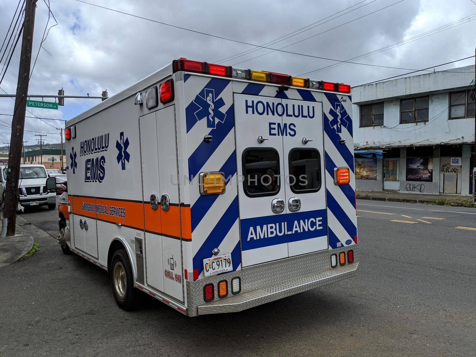 Honolulu - August 5, 2020: Emergency Medical Services (EMS) Paramedic Unit Ambulance parked in intersection..