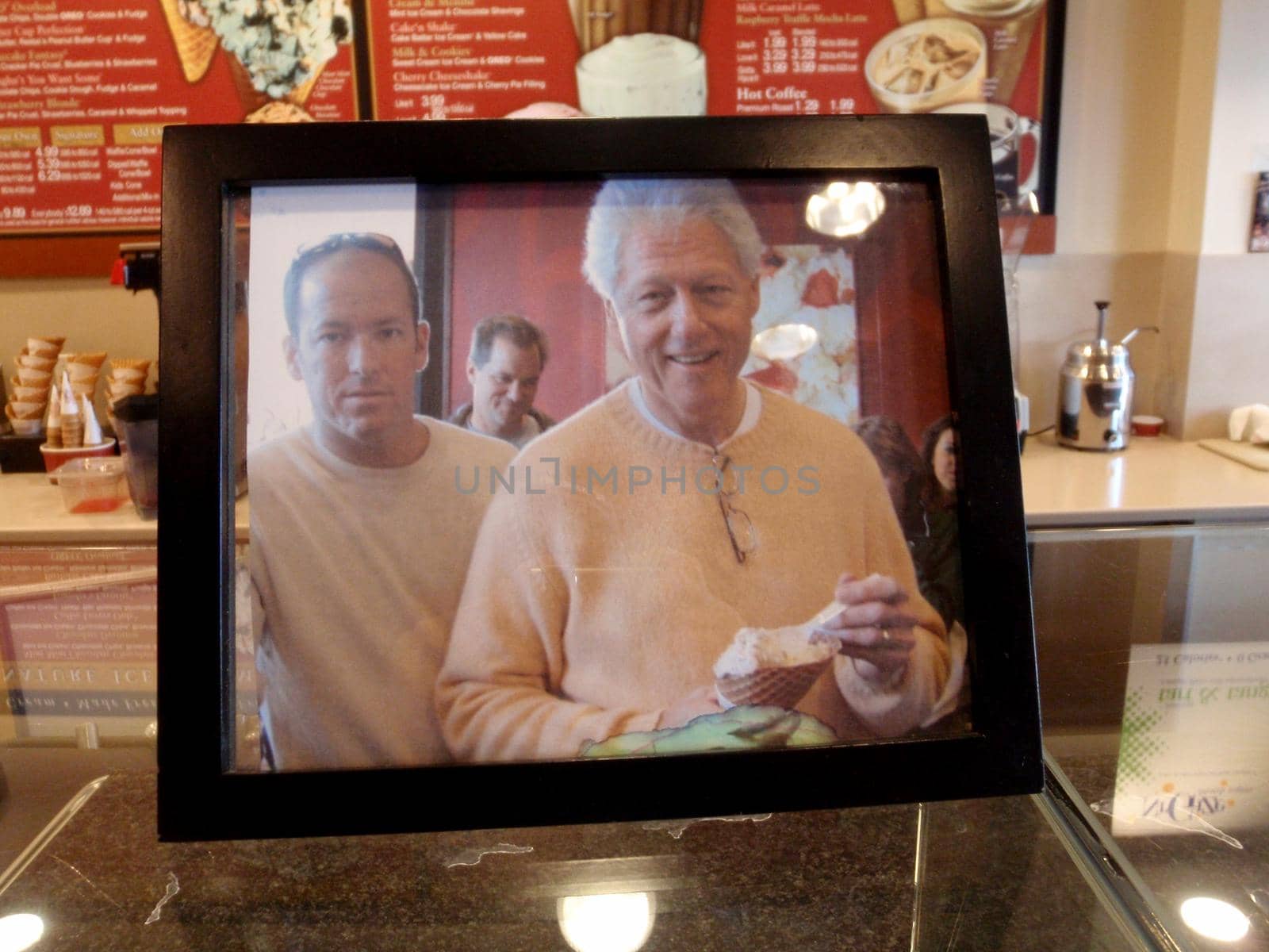 Bill Clinton eating ice cream photo on display inside ice cream store by EricGBVD