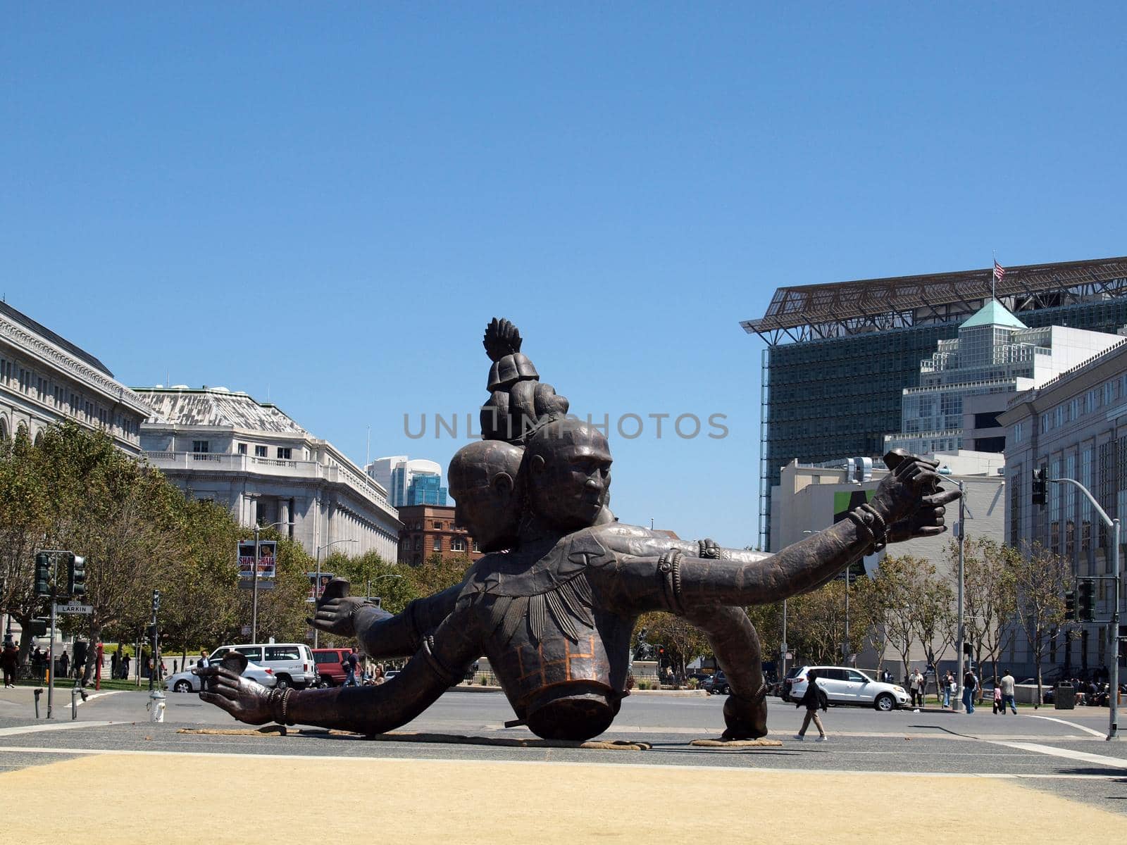 San Francisco - August 19, 2010: Three Heads Six Arms by Zhang Huan, made in 2008, on display in San Francisco Civic Center during the day. The work, composed of copper and steel, is 27 feet tall and weighs 15 short tons.
