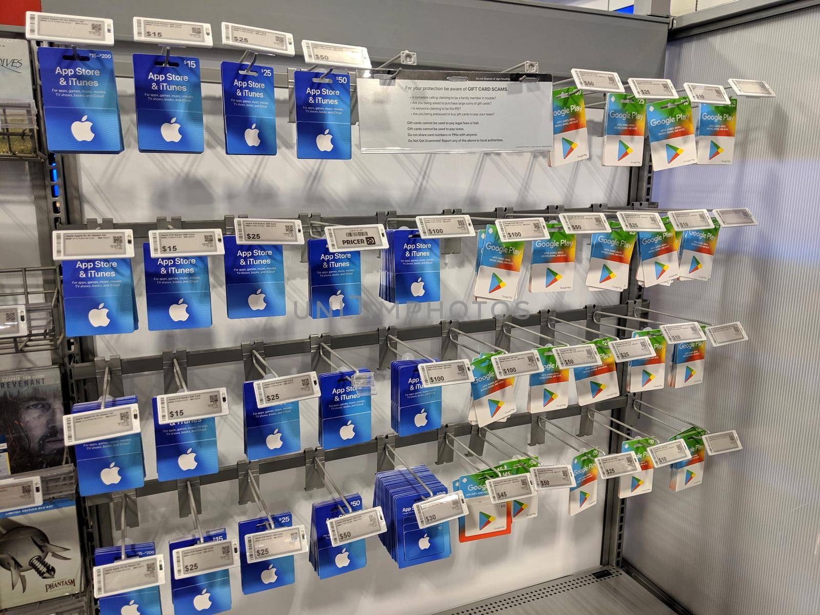 Honolulu - August 19, 2019:  Apple Itunes App Store and Google Play Gift Cards on display on rack at Best Buy.  