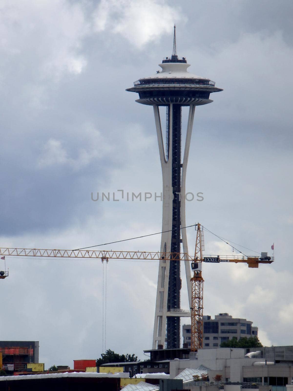 Skyscraper under construction and the Space Needle by EricGBVD