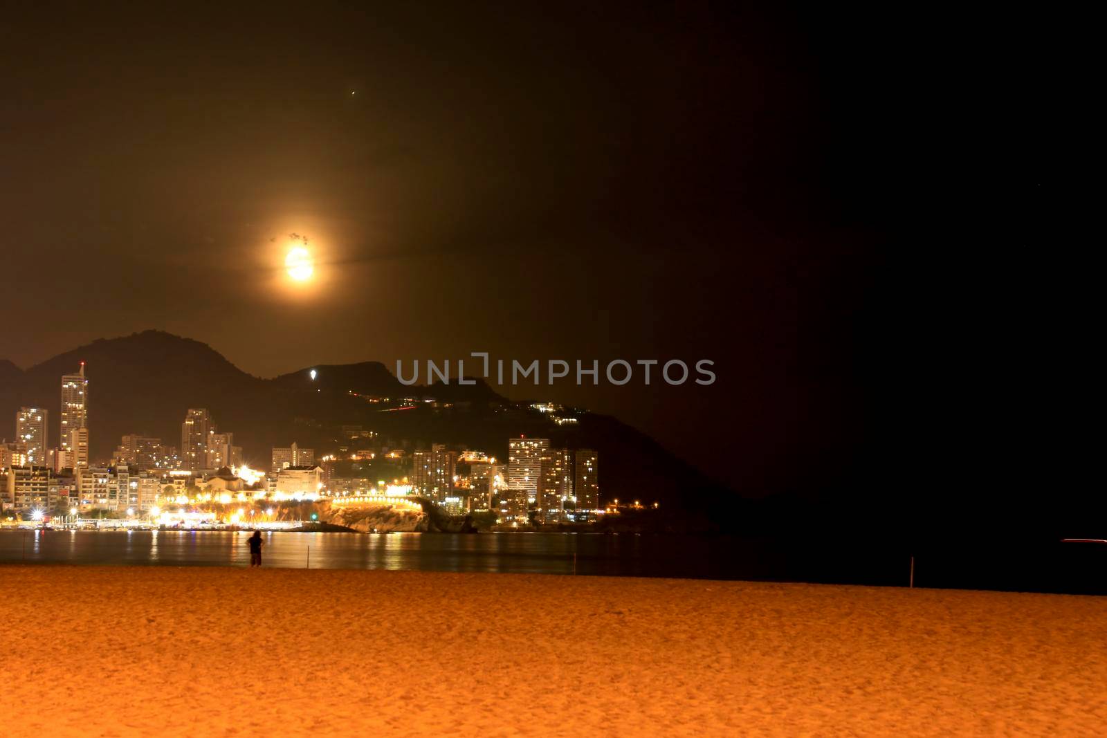 Panoramic view of Benidorm on a full moon night by soniabonet