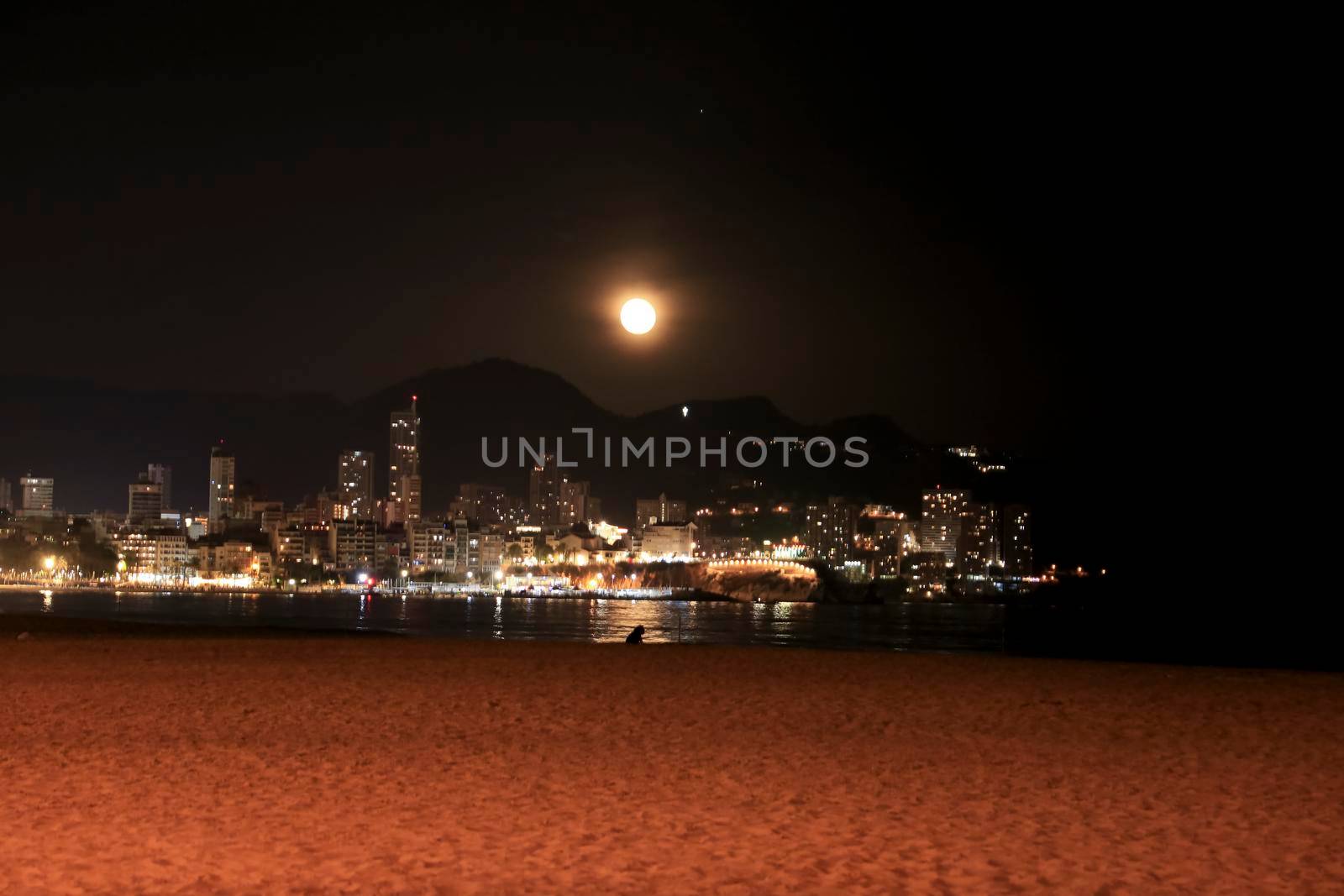 Benidorm, Alicante, Spain- September 11, 2022: Beautiful panoramic view of Benidorm town on a full moon night