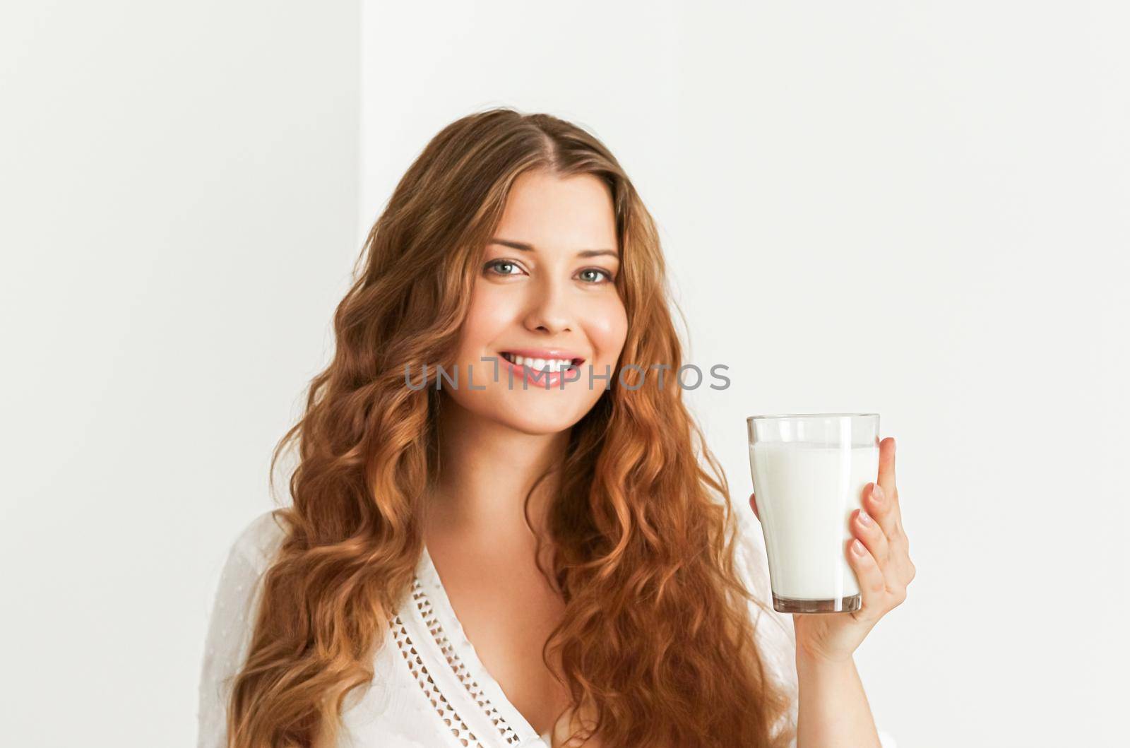 Diet, health and wellness concept, woman holding glass of milk or protein shake cocktail