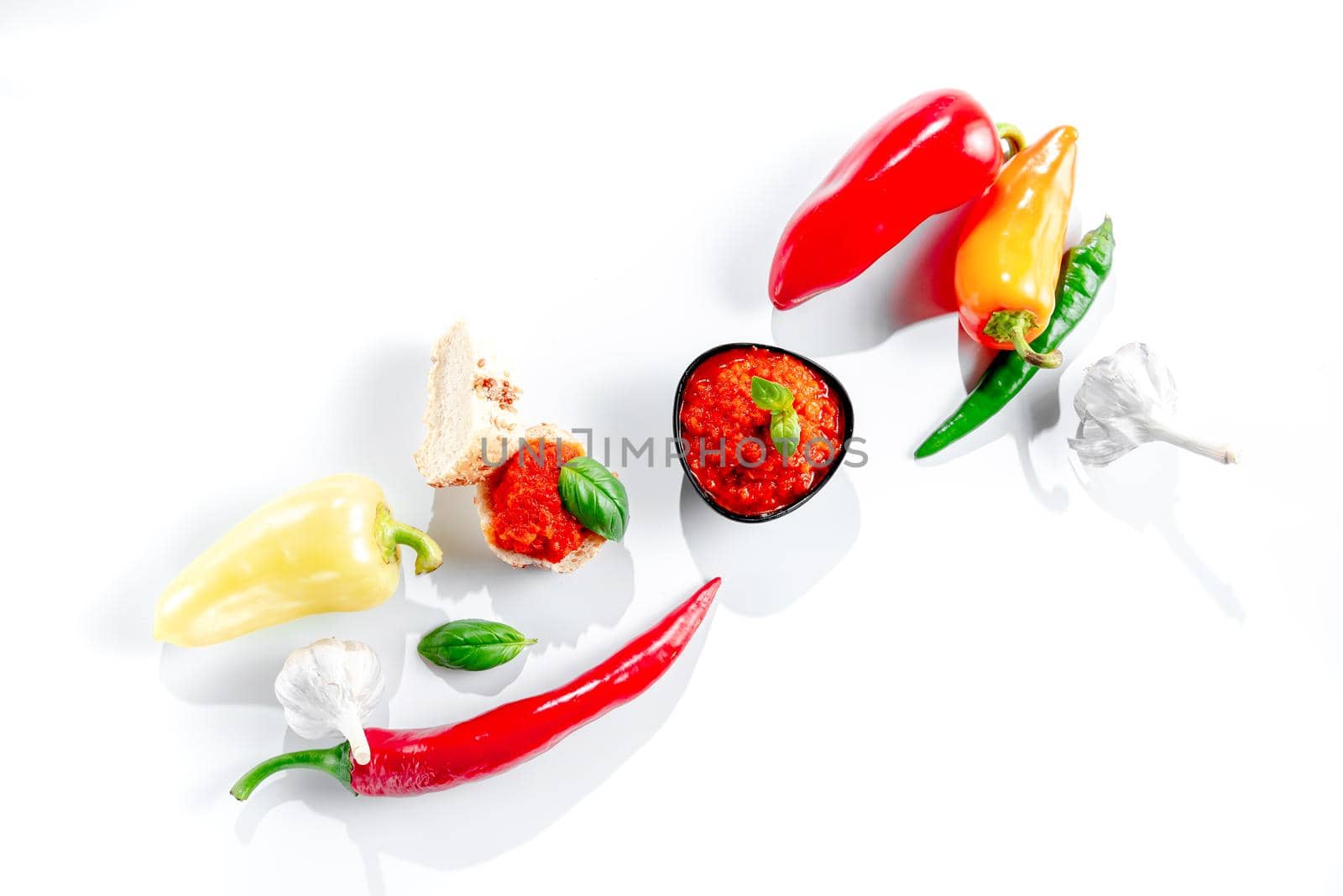 Ajvar with ingredients on white background top view. Ajvar homemade