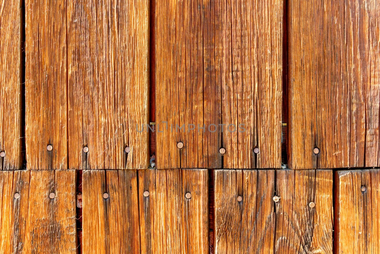 Grunge wood texture. Raw brown wooden wall background. Village building construction.