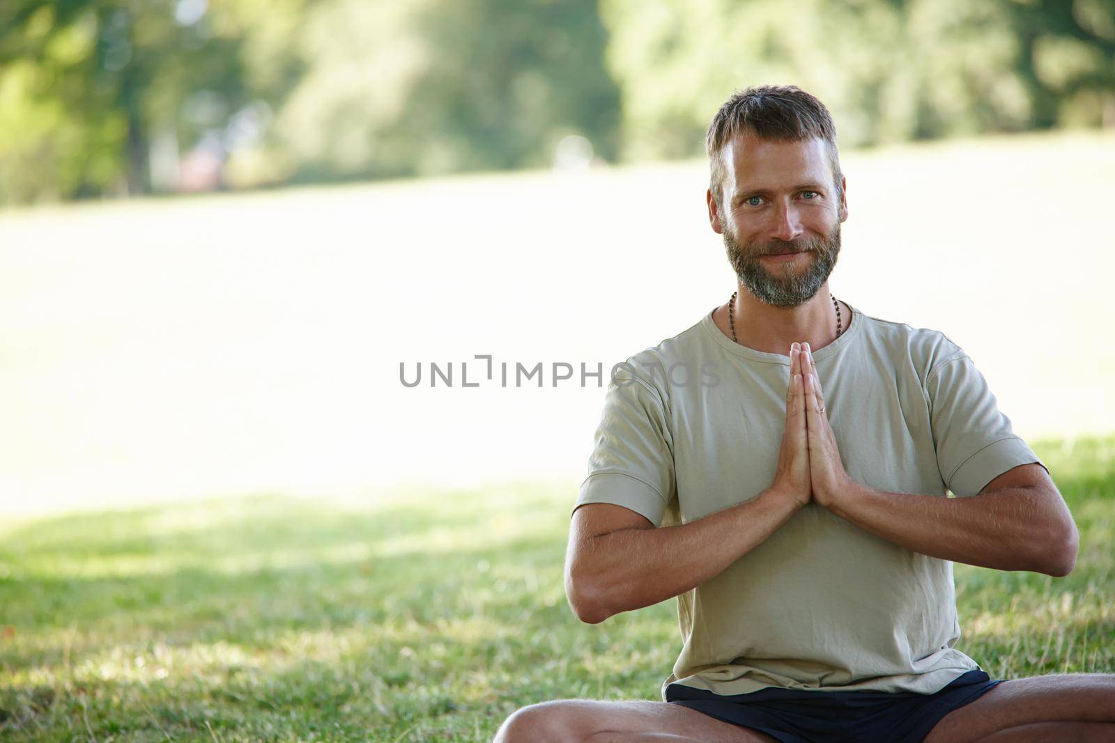 Yoga works for me. Cropped portrait of a handsome mature man doing yoga outdoors. by YuriArcurs