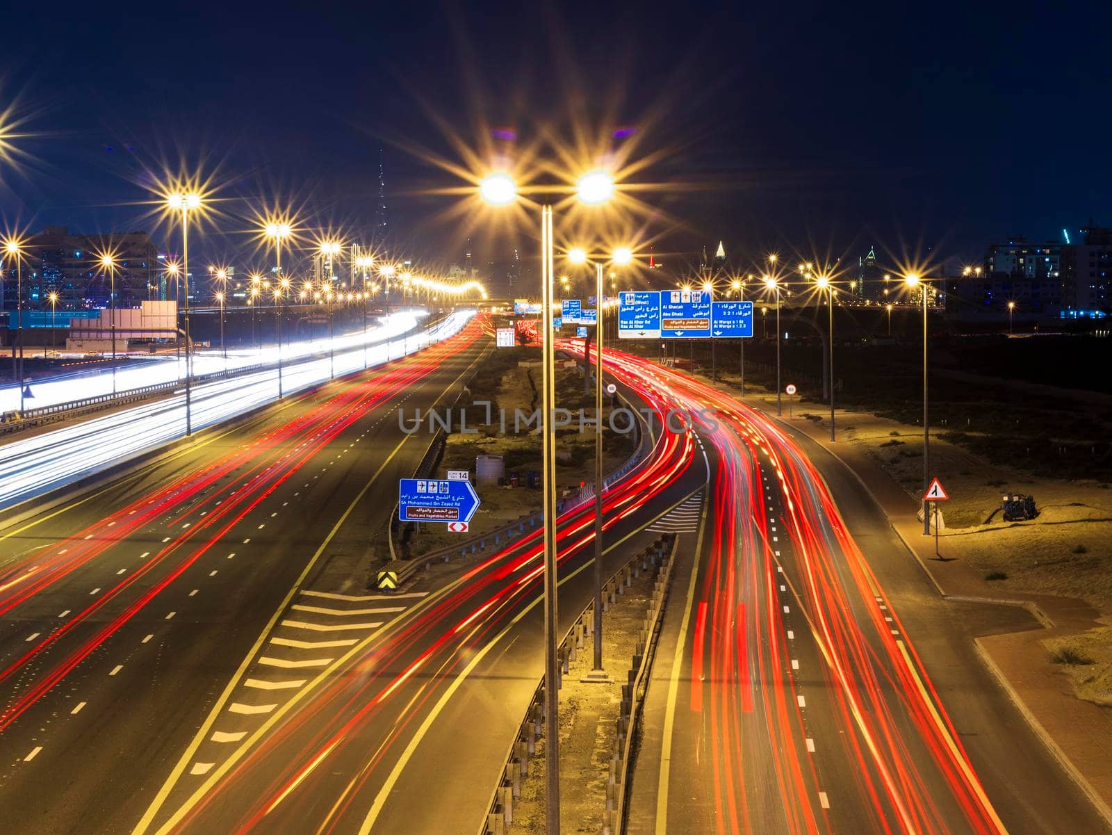 Dubai, UAE - 02.22.2021 Shot of a night road with light trails.